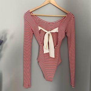Red and white striped body suit.